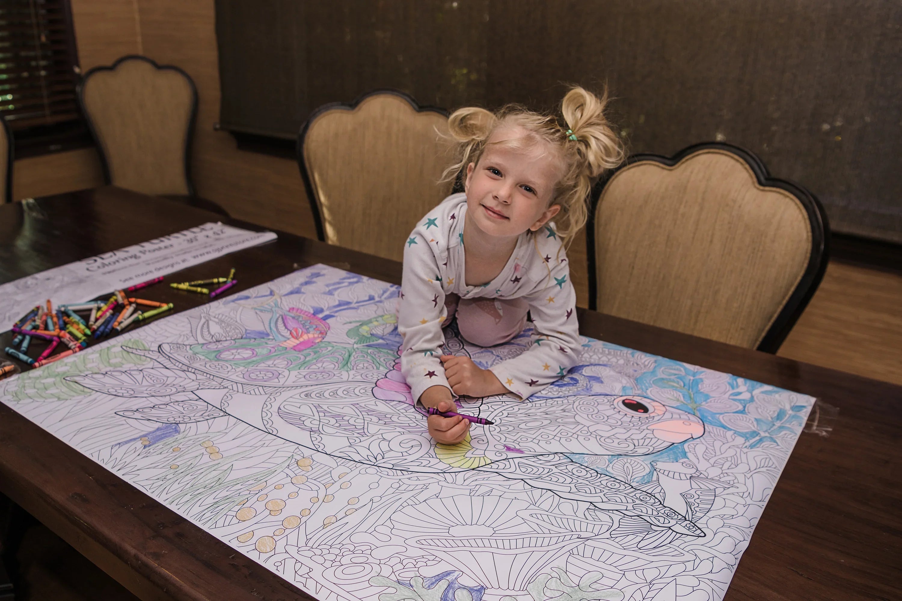 Child coloring a giant poster as a sensory activity — fine motor and tactile sensory play by SJPrinter