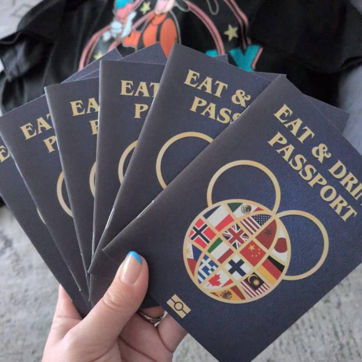 Six EPCOT Eat & Drink Passport booklets with world flags globe cover — printed by SJPrinter in Cherry Hill NJ