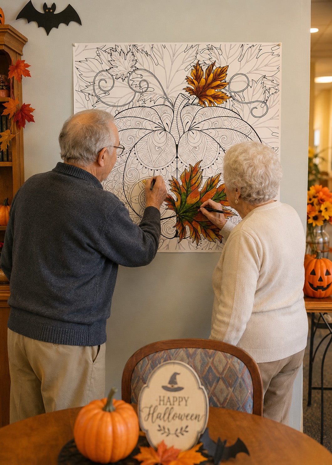 Two senior residents coloring a giant Halloween fall leaf poster mounted on a wall at a senior center decorated for Oct