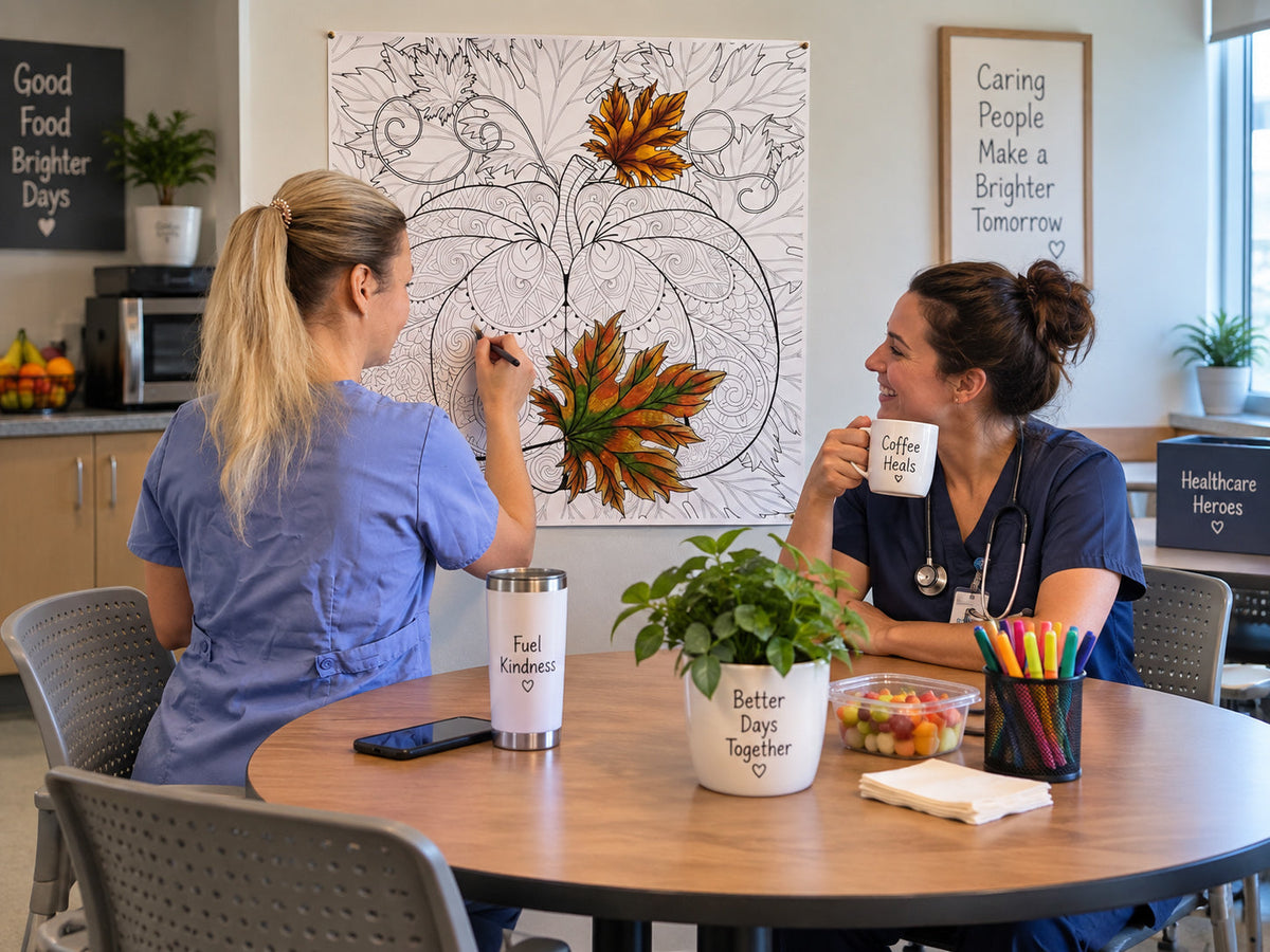 Two nurses in a hospital break room coloring a giant autumn leaf coloring poster on the wall, markers and coffee on the table